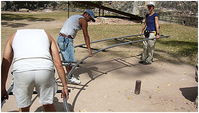 Producer Rosey Guthrie and the grips lay dolly track at Copán.