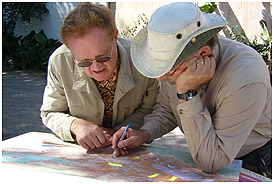 Anthropologist Dennis Tedlock (left) and director Lebrun plan a route in the Guatemalan highlands.